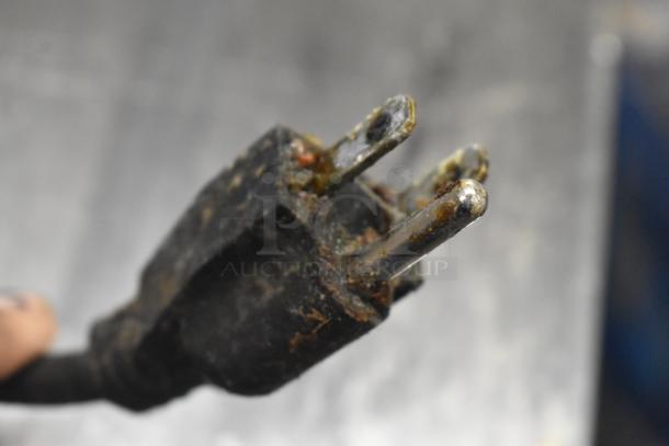 Corroded plug of Avantco Commercial Food Warmer, 120V, 1 Phase, highlighting wear. Potential need for cleaning or replacement.