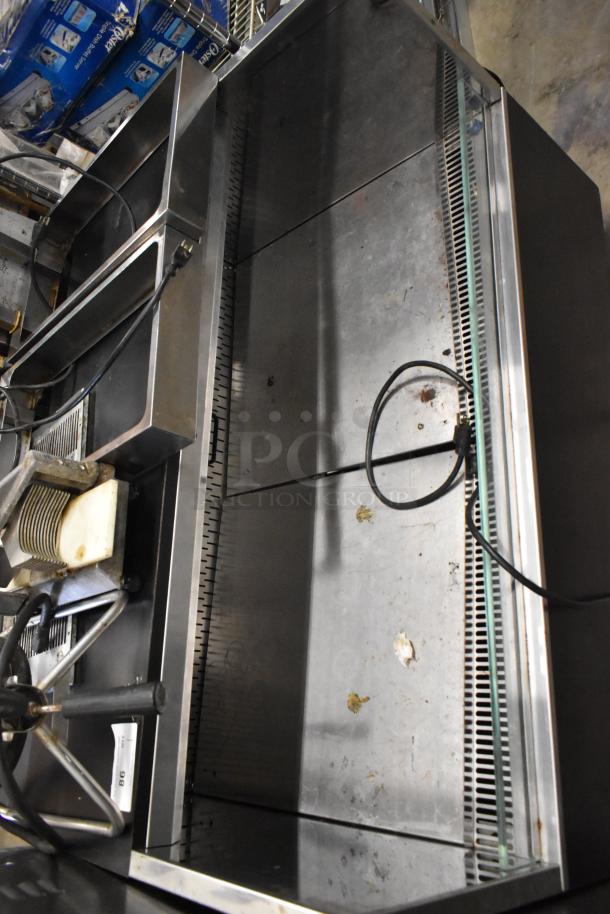 Metal commercial Grab N Go merchandiser, floor style, horizontal layout, 115 volts, 1 phase, visible power cords.