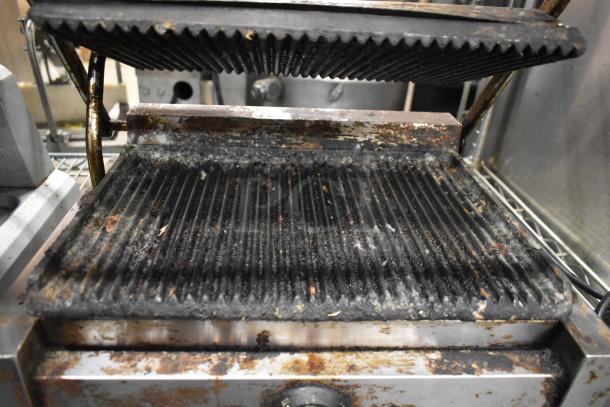 Adcraft SG-811 Panini Press, metal, countertop model, 120V, visibly worn with grill marks and grease buildup.