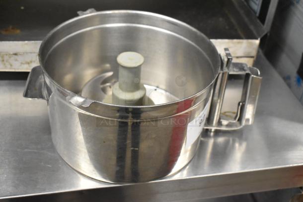 Metal food processor bowl with S blade visible, includes dough hook attachment and scissors. Shiny condition with side latch.