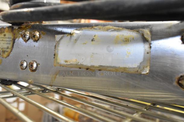 Avantco Metal Countertop Warmer, 120 Volts, 1 Phase, shows rust and wear, unclear label, durable stainless steel construction.