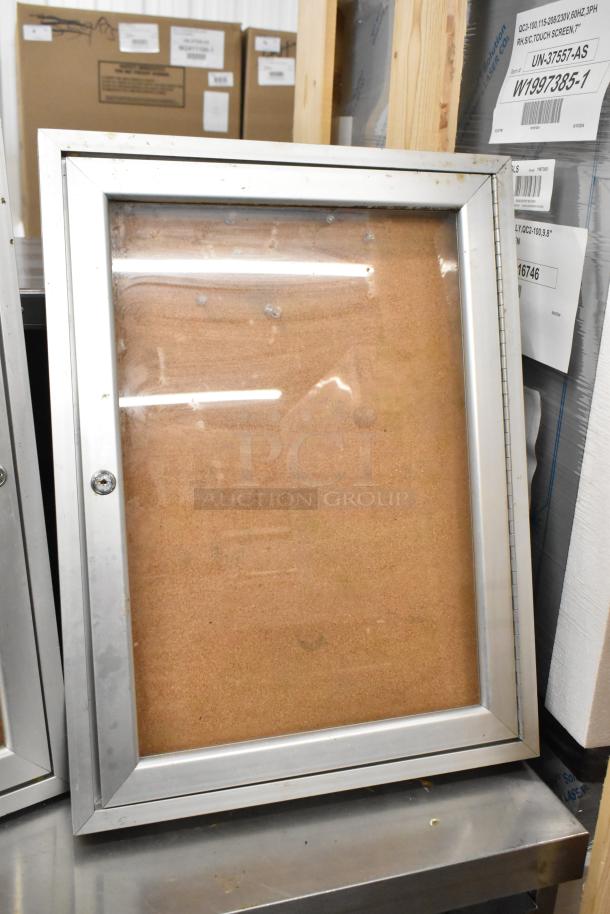Aluminum shadowbox with clear front, no lock. Slight wear visible. Auction item includes two boxes per bid.