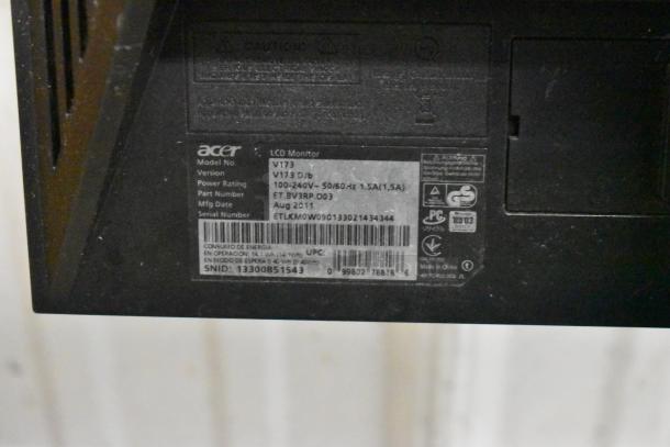 Acer V173 LCD monitor label showing model, version V173 DJb, power rating 100-240V, serial number ETLKM0W090133021434344.