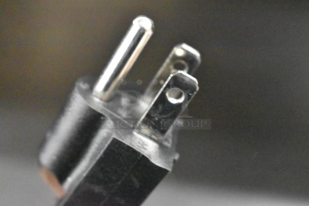 Close-up of a power plug for the AvaMix 928IBHD21 21" Heavy-Duty Immersion Blender, 120 Volts, 1 Phase.