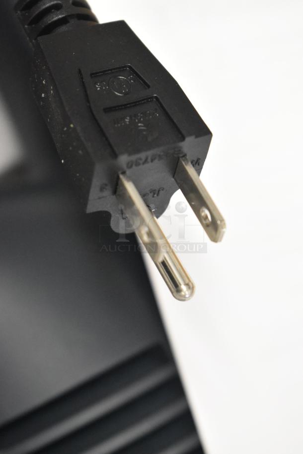 AvaMix 928IBHD12DX immersion blender power plug, 120 volts. Close-up showing detailed plug design and condition.