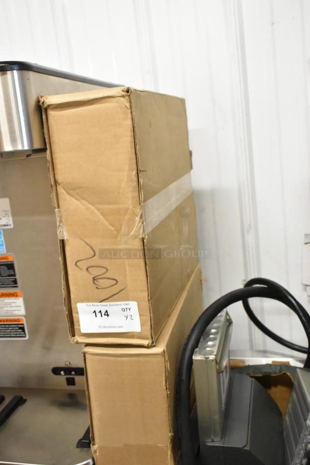 2 new 3M SW260-PLUS water filter cartridges in cardboard box with visible scratch and dent, auction label "114, QTY 2X".