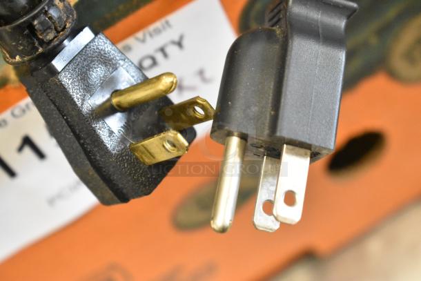 Close-up of plug connections for countertop coin sorter, 115 volts, single phase. Appears in good condition.