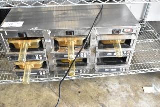 Carter Hoffmann MC3W2SN01 stainless steel holding bin, 120V, 1 phase, with visible "Caution Hot" labels and digital controls.