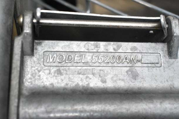 Nemco 55200AN metal vegetable slicer, close-up of model marking, showing durable metal construction in good condition.