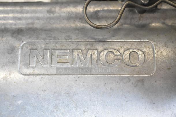 Nemco 55200AN metal countertop vegetable slicer with visible brand engraving, showing signs of wear.