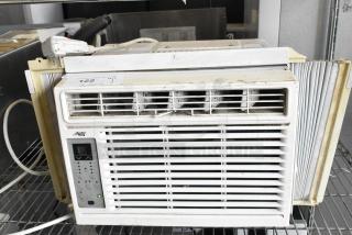 Arctic King window air conditioner, 115 volts, 1 phase, used condition, visible controls and label, minor wear.