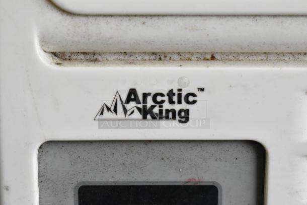 Arctic King window mount air conditioner, 115 volts, showing brand logo. Visible dirt and wear indicate used condition.