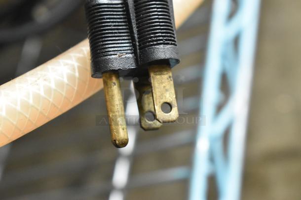 Shurflo Water Booster, 115V, 1 Phase, features brass-plated plug and hose, shows minor wear, indicating well-used condition.