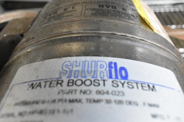 Shurflo Water Booster, 115V, 1 Phase, label shows part number 804-023 and usage specs, in used condition.