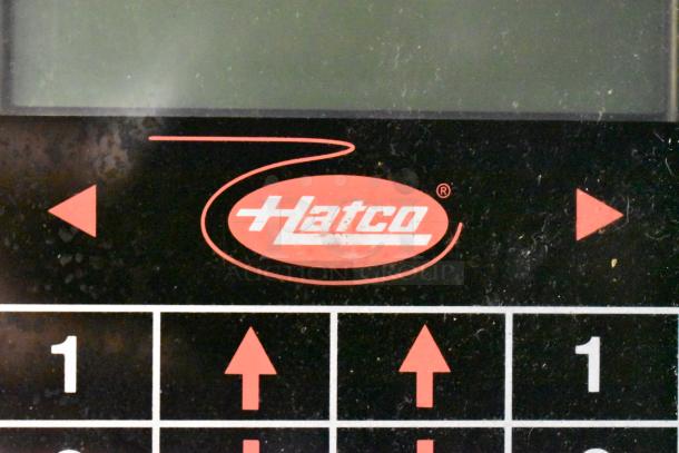 Hatco ITQ-1750-2C conveyor toaster control panel with logo, black surface, and red arrow buttons, suitable for commercial use.