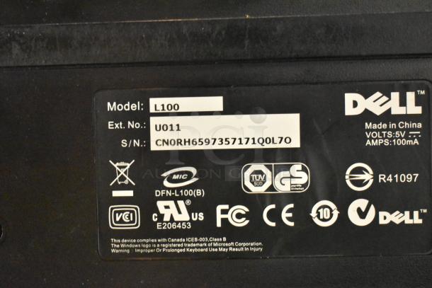 Dell device label showing Model L100, Ext. No. U011, S/N: CNORH6597357171Q0L7O, compliance logos, made in China.