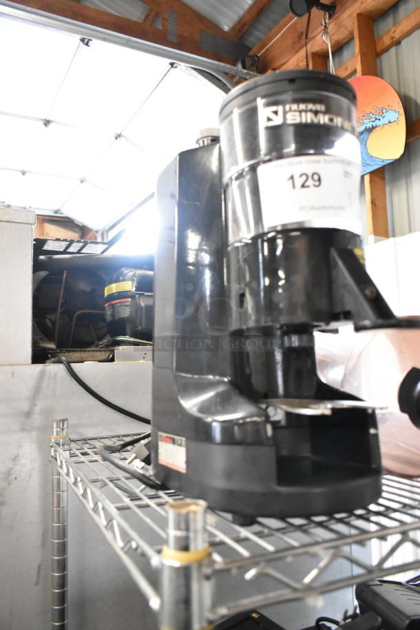 Nuova Simonelli MDX metal espresso bean grinder, black, commercial countertop model, 115V, used condition, auction tag visible.