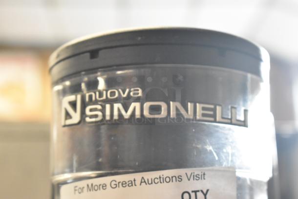 Nuova Simonelli MDX espresso grinder, metal finish, commercial grade, 115V, single-phase, with brand logo visible.