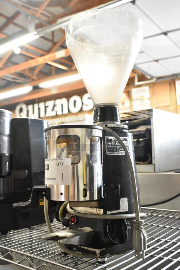 Magister M MD LA espresso bean grinder, metal body, 115 volts, 1 phase, with visible wear, auction tag attached.