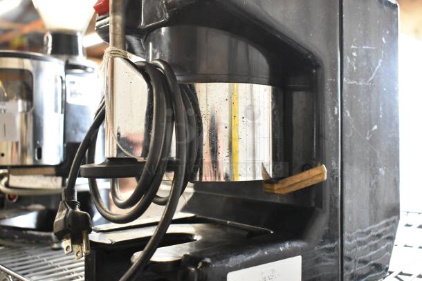 Metal commercial countertop espresso bean grinder, 115 volts, 1 phase, in used condition with visible scuffs and power cord.