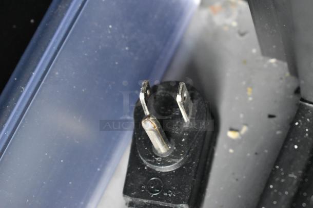 Close-up of a power plug for the 2022 True TVM-48SL-HC commercial cooler, 115 volts, 1 phase.