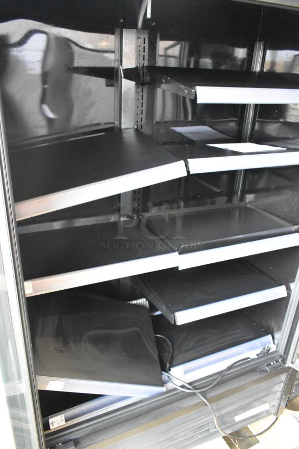 2022 True TVM-48SL-HC 2-door cooler with metal racks, black interior, 115V, 1 phase, excellent condition.