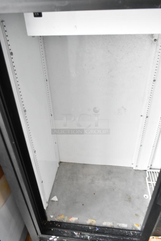 True GDM-41SL-54-LD commercial cooler interior, metal frame, poly-coated rack, visible signs of use, 115V, 1 Phase.