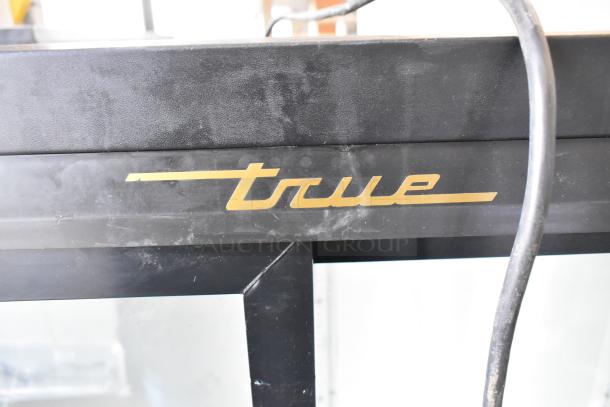 True GDM-41SL-54-LD cooler close-up, showing metal construction with visible True logo. 115 Volts, 1 Phase.