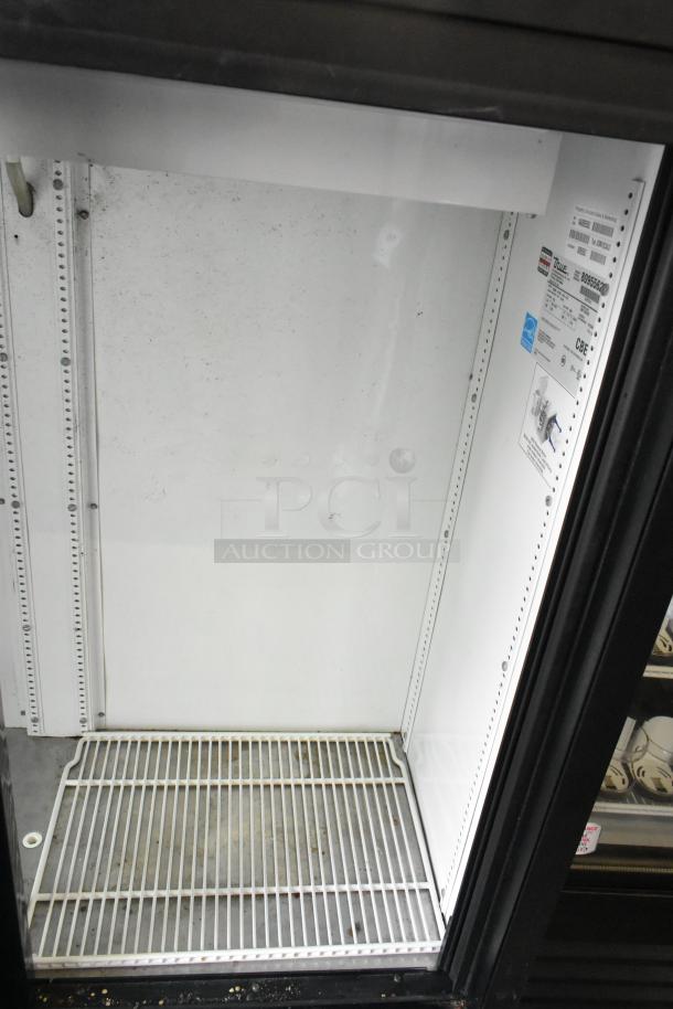 True GDM-41SL-54-LD metal commercial cooler, 2-door, with poly-coated rack, 115 volts, used condition, interior labels visible.