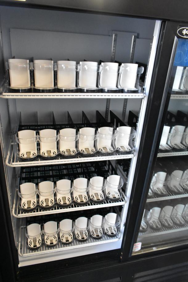 2025 QBD CD4160-HC 2 Door Reach-In Cooler, metal, poly-coated racks, 115V 1 Ph, excellent condition, multiple shelves.