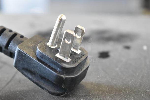 Power plug of QBD CD4160-HC commercial cooler. 115 volts, 1 phase. Features durable metal construction.