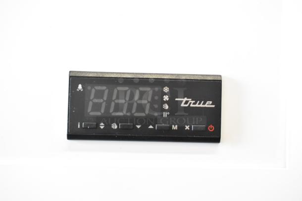 Control panel of 2021 True TSCI-600R-G-PH cooler, featuring digital display and control buttons.