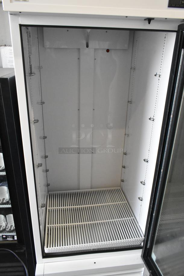 2021 True TSCI-600R-G-PH commercial cooler, single glass door, poly-coated racks, 115V, 1 phase, excellent condition.