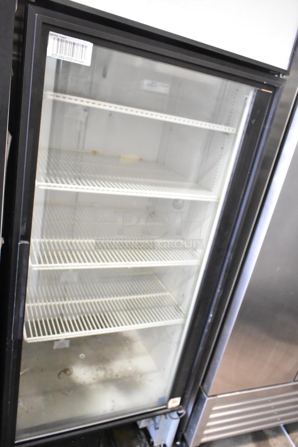 True GDM-26 commercial cooler with single glass door, metal body, and poly-coated racks. 115V, 1 phase. Moderate wear.