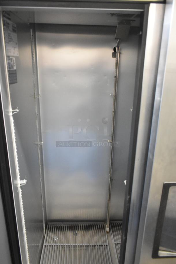 2022 True T-35-HC stainless steel commercial reach-in cooler, two doors, poly-coated racks, excellent condition.