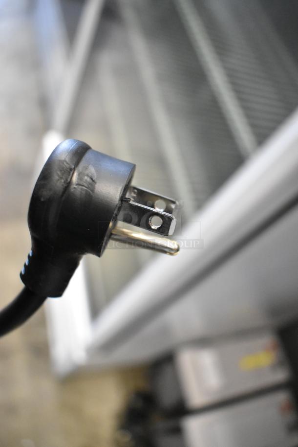 2021 True TSCI-600R-G-PH commercial cooler with poly coated racks, single door, 115V, 1 phase plug shown.