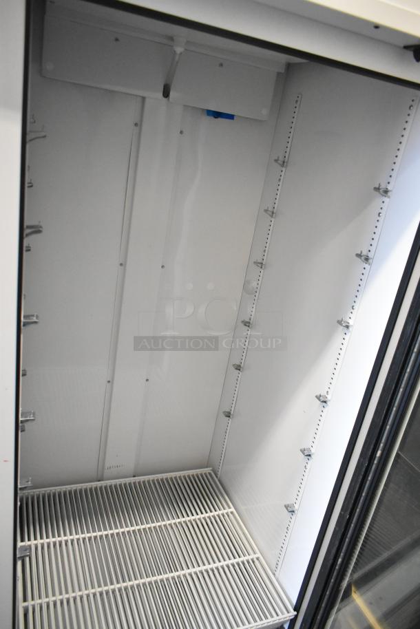 2021 True TSCI-600R-G-PH single door reach-in cooler with poly-coated racks, 115V, new condition.