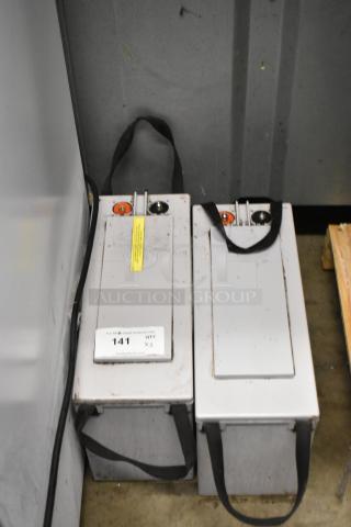 2 NexSys 12NXS157 TPPL batteries with handles, minor wear. Label indicates "Quantity X2" for auction.