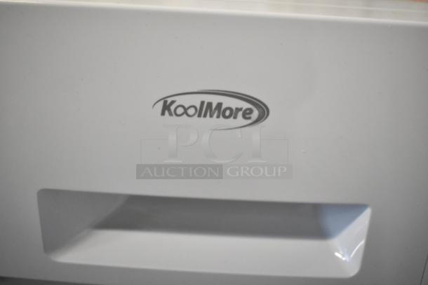 BRAND NEW KoolMore FLW-3CWH 2.7 cu. ft. stackable front load washing machine, 120V, with minor scratches. Logo visible.
