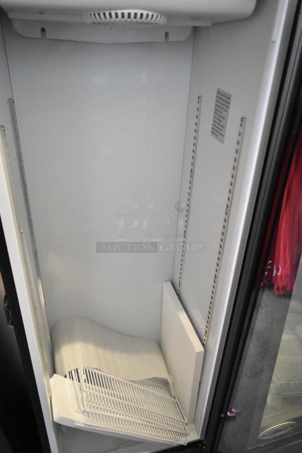 Brand new KoolMore KM-MDR-1GD-10C commercial display refrigerator. Single door, metal finish, 115 volts, minor scratches.