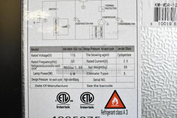 KoolMore KM-MDR-1GD-10C display refrigerator label showing model, power specifications, and safety warnings. 