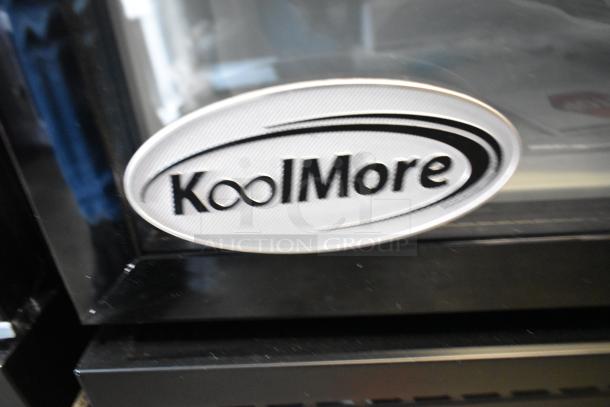 KoolMore KM-MDR-1GD-10C display refrigerator, metal, single door, 115V, brand new with scratches, KoolMore logo visible.