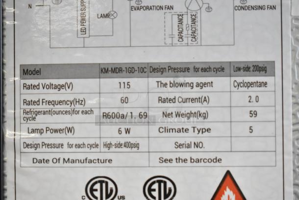 Label showing specs for KoolMore KM-MDR-1GD-10C refrigerator. Includes 115 volts, R600a refrigerant, and ETL certification.