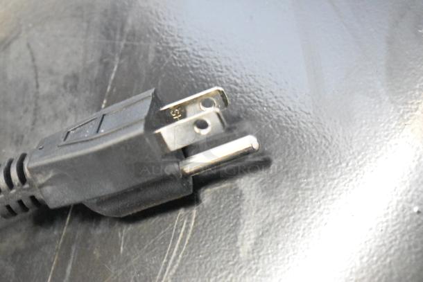 Alt text: Close-up of the power plug for the Frigidaire FGFRF5009-B-BLACK-6COM chest freezer.