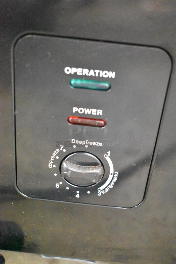 Frigidaire FGFRF5009-B-BLACK-6COM chest freezer controls, showing operation and power indicators.