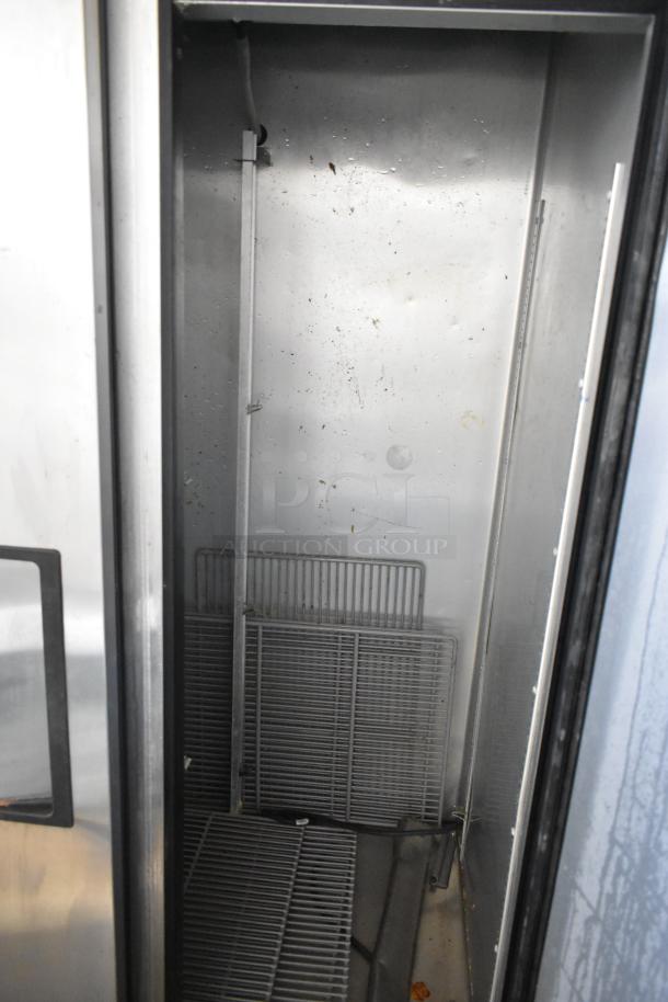 2016 True T-35-HC stainless steel commercial cooler, features poly-coated racks, minor wear visible, 115V, 1 phase.