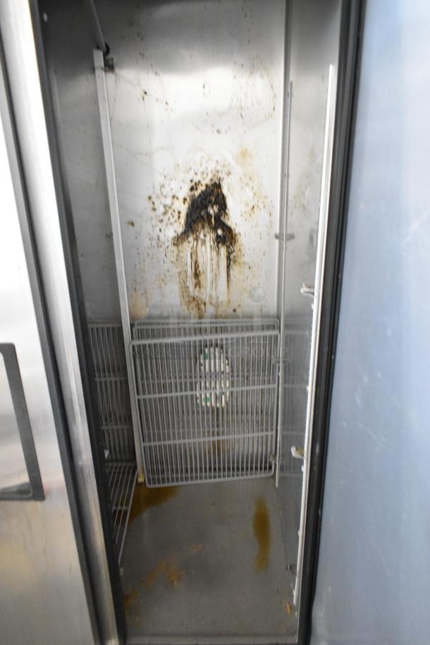 2016 True T-35-HC stainless steel commercial cooler, 2 doors, poly coated racks, interior needs cleaning, 115V, 1 phase.