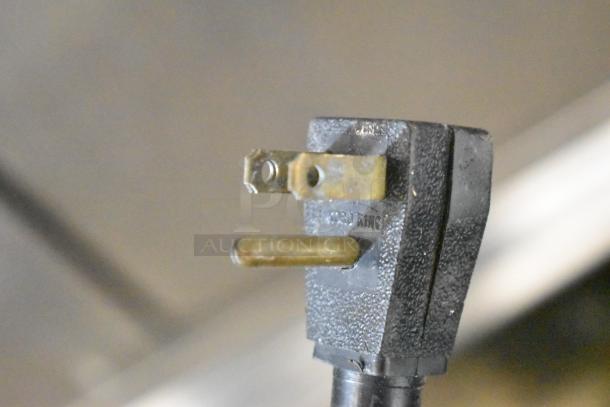 2016 True T-35-HC cooler plug close-up, showing standard 115V compatibility; no visible damage.