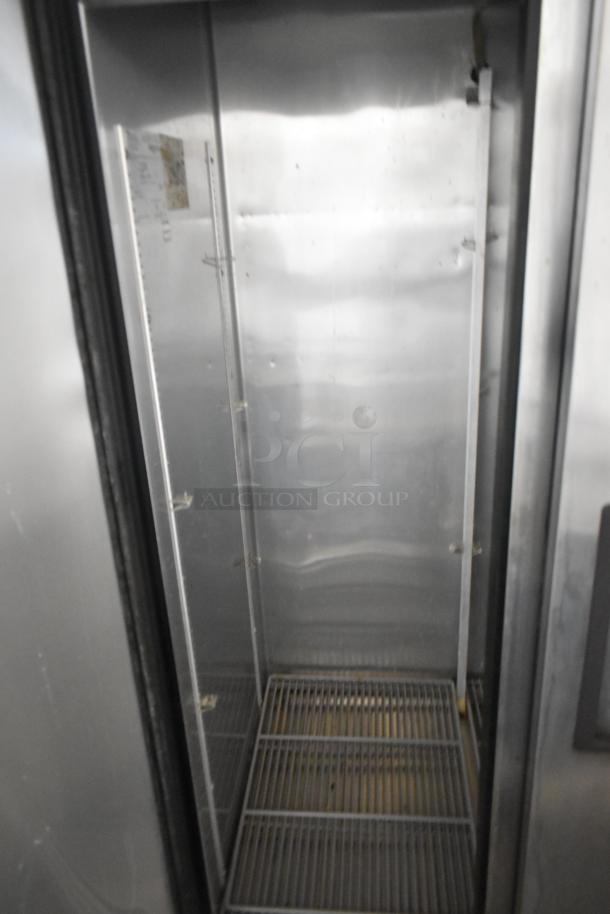 True T-35-HC stainless steel commercial 2-door cooler, poly coated racks visible, 115V, 1 phase, clean interior.