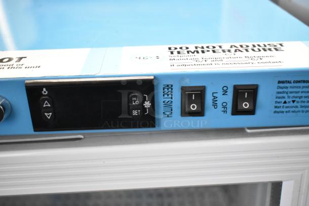 2019 Accucold ARG3PV mini cooler controller panel showing digital controls, reset switch, and lamp toggle.